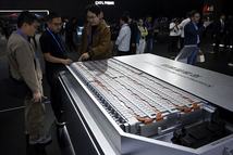 People look at a model of CATLs Qilin Condensed Battery during the CATL Tech Day event ahead of the Beijing Auto Show in Beijing on April 21, 2026. (Photo by WANG Zhao / AFP)
