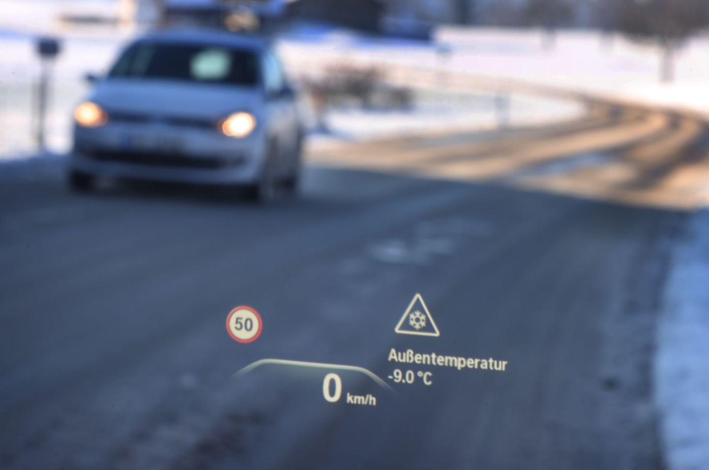 11 December 2022, Bavaria, Ruderatshofen: A head-up display on the windshield of a car indicates a danger of icy roads and a temperature of minus nine degrees Celsius. Photo: Karl-Josef Hildenbrand/dpa (Photo by Karl-Josef Hildenbrand/picture alliance via Getty Images)