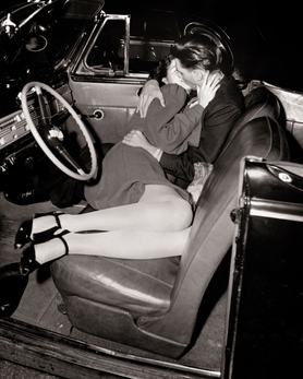 1940s Close-Up Of Passionate Hugging Kissing Couple Man Woman Lying In Front Seat Of Convertible Car At Outdoor Drive-In Movie (Photo by American Stock/Getty Images)
