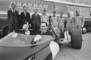 Australian racing driver Jack Brabham (1926 - 2014) and his racing team, 23rd September 1966. From left to right, manager and PA Phil Kerr, engineer John Judd, designer Ron Tauranac, and mechanics Cary Taylor, Hughie Absalom, John Muller, Roy Billington and Bob Ilich. (Photo by Victor Blackman/Express/Hulton Archive/Getty Images)