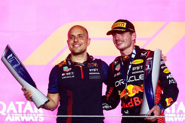 LUSAIL CITY, QATAR - OCTOBER 08: Race winner Max Verstappen of the Netherlands and Oracle Red Bull Racing and race engineer Gianpiero Lambiase celebrate on the podium during the F1 Grand Prix of Qatar at Lusail International Circuit on October 08, 2023 in Lusail City, Qatar. (Photo by Clive Rose/Getty Images)