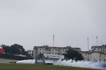 Interlagos, Sao Paulo, Brazil. Sunday 24th November 2013. Romain Grosjean, Lotus E21 Renault, coasts to a stop as his engine erupts in a pall of smoke. (Photo by Glenn Dunbar/LAT Images)
