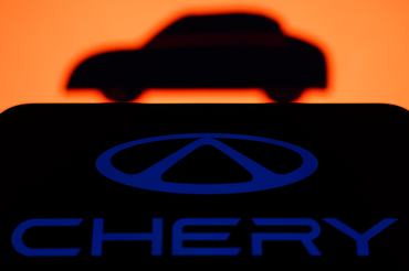An illustrative image of a car displayed on a laptop screen and Chery logo displayed on a phone screen are seen in this illustration photo taken in Krakow, Poland on January 2, 2025. (Photo by Jakub Porzycki/NurPhoto via Getty Images)