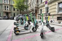 Innsbruck, Austria. July 31, 2025. some electric scooters for rent on a sidewalk in the city center