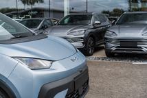Crewe, Cheshire, England, August 30th 2025. A pale blue BYD Dolphin is parked at the dealership forecourt, with cars in the background.