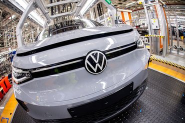 PRODUCTION - 24 February 2026, Lower Saxony, Emden: An ID.4 vehicle drives along a conveyor belt through the production hall at the Volkswagen plant (shot with fisheye lens). The Volkswagen plant in Emden has been fully geared towards the production of electric cars since 2024. Photo: Hauke-Christian Dittrich/dpa (Photo by Hauke-Christian Dittrich/picture alliance via Getty Images)