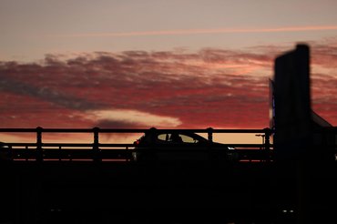 A car drives along the road during sunset in Warsaw, Poland, on March 3, 2026. (Photo by Klaudia Radecka/NurPhoto via Getty Images)