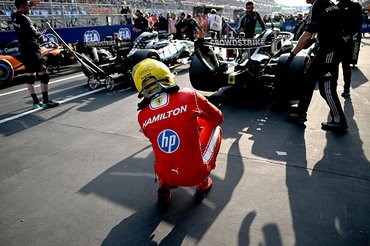 SHANGHAI, CHINA - MARCH 13: Fourth placed qualifier Lewis Hamilton of Great Britain and Scuderia Ferrari looks at the Mercedes AMG Petronas F1 Team car in parc ferme during Sprint qualifying ahead of the F1 Grand Prix of China at Shanghai International Circuit on March 13, 2026 in Shanghai, China. (Photo by Mark Sutton - Formula 1/Formula 1 via Getty Images)