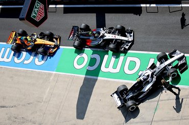 SHANGHAI, CHINA - MARCH 14: Valtteri Bottas of Finland driving the (77) Cadillac F1 Team MAC-26 Ferrari, Gabriel Bortoleto of Brazil driving the (5) Audi F1 Team R26 and Lando Norris of Great Britain driving the (1) McLaren MCL40 Mercedes in the Pitlane during the Sprint ahead of the F1 Grand Prix of China at Shanghai International Circuit on March 14, 2026 in Shanghai, China. (Photo by Anni Graf - Formula 1/Formula 1 via Getty Images)