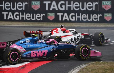 SHANGHAI, CHINA - MARCH 15: Esteban Ocon of France driving the (31) Haas F1 VF-26 Ferrari and Franco Colapinto of Argentina driving the (43) Alpine F1 A526 Mercedes make contact on track during the F1 Grand Prix of China at Shanghai International Circuit on March 15, 2026 in Shanghai, China. (Photo by Rudy Carezzevoli/Getty Images)