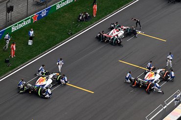 SHANGHAI, CHINA - MARCH 15: Esteban Ocon of France and Haas F1 Arvid Lindblad of Great Britain and Visa Cash App Racing Bulls and Liam Lawson of New Zealand and Visa Cash App Racing Bulls on the grid during the F1 Grand Prix of China at Shanghai International Circuit on March 15, 2026 in Shanghai, China. (Photo by Mark Sutton - Formula 1/Formula 1 via Getty Images)