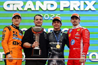 SUZUKA, JAPAN - MARCH 29: Race winner Andrea Kimi Antonelli of Italy and Mercedes AMG Petronas F1 Team Second placed Oscar Piastri of Australia and McLaren Third placed Charles Leclerc of Monaco and Scuderia Ferrari and the Mercedes AMG Petronas F1 Team team representative celebrate on the podium during the F1 Grand Prix of Japan at Suzuka Circuit on March 29, 2026 in Suzuka, Japan. (Photo by Rudy Carezzevoli/Getty Images)