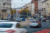 Budapest, Hungary - November 8, 2025: Commuters and cars on a busy Budapest street with blurred motion and tram