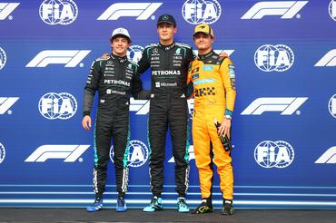 MONTREAL, QUEBEC - MAY 23: Pole position qualifier George Russell of Great Britain and Mercedes AMG Petronas F1 Team Second placed qualifier Andrea Kimi Antonelli of Italy and Mercedes AMG Petronas F1 Team and Third placed qualifier Lando Norris of Great Britain and McLaren look on during qualifying ahead of the F1 Grand Prix of Canada at Circuit Gilles-Villeneuve on May 23, 2026 in Montreal, Quebec. (Photo by Bryn Lennon - Formula 1/Formula 1 via Getty Images)