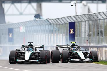 MONTREAL, QUEBEC - MAY 24: George Russell of Great Britain driving the (63) Mercedes AMG Petronas F1 Team W17 passes Andrea Kimi Antonelli of Italy driving the (12) Mercedes AMG Petronas F1 Team W17 for the lead during the F1 Grand Prix of Canada at Circuit Gilles-Villeneuve on May 24, 2026 in Montreal, Quebec. (Photo by Bryn Lennon - Formula 1/Formula 1 via Getty Images)
