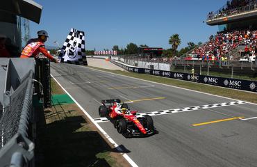 BARCELONA, SPAIN - JUNE 14: Race winner Lewis Hamilton of Great Britain driving the (44) Scuderia Ferrari SF-26 takes the chequered flag during the F1 Grand Prix of Barcelona-Catalunya at Circuit de Barcelona-Catalunya on June 14, 2026 in Barcelona, Spain. (Photo by Clive Rose/Getty Images)