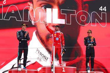 BARCELONA, SPAIN - JUNE 14: Race winner Lewis Hamilton of Great Britain and Scuderia Ferrari Second placed George Russell of Great Britain and Mercedes AMG Petronas F1 Team and Third placed Lando Norris of Great Britain and McLaren on the podium during the F1 Grand Prix of Barcelona-Catalunya at Circuit de Barcelona-Catalunya on June 14, 2026 in Barcelona, Spain. (Photo by Clive Rose/Getty Images)