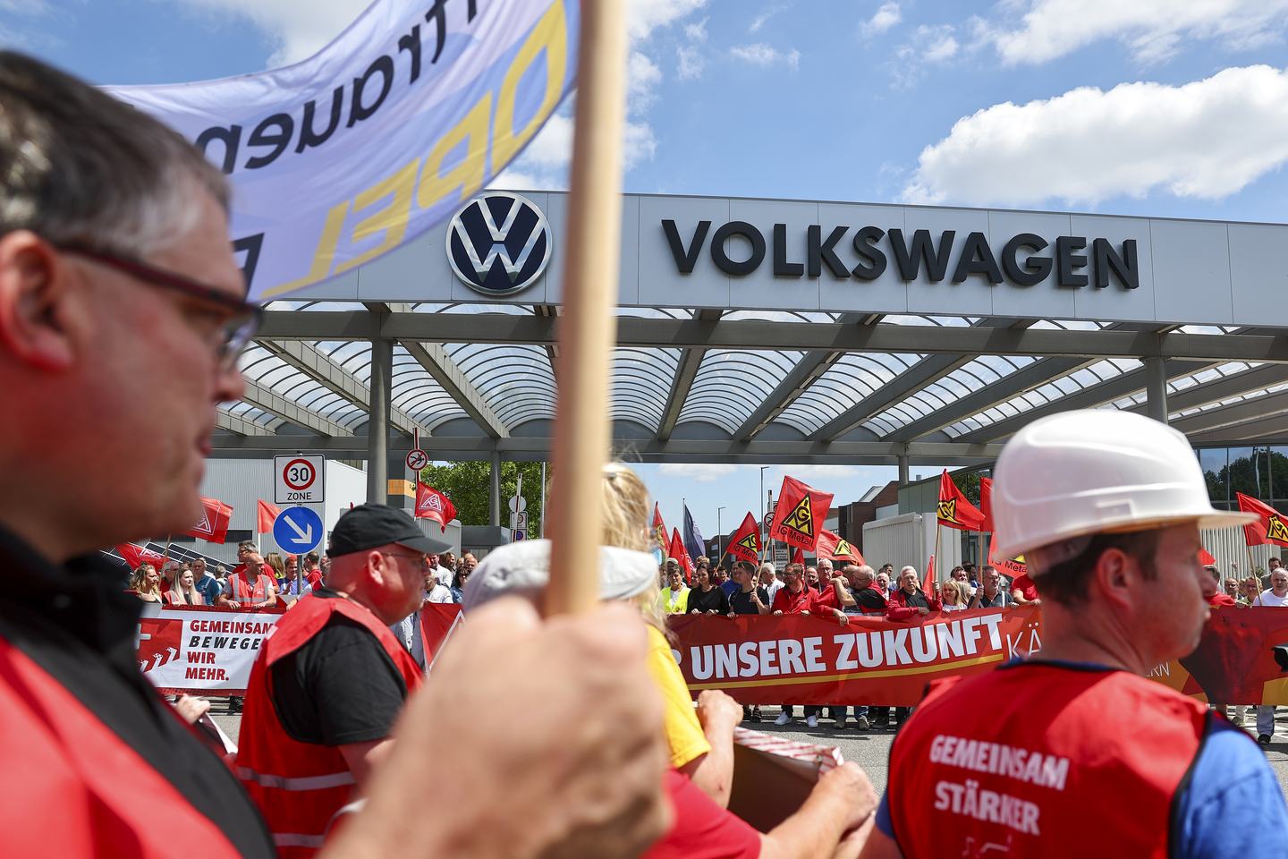 09 July 2026, Saxony, Zwickau: Opel Eisenbach employees show solidarity with Volkswagen employees at an information and protest event organized by IG Metall in front of the VW plant in Zwickau. On the day of the Volkswagen AG supervisory board meeting in Wolfsburg, IG Metall is organizing information and protest events nationwide at numerous locations within the company. Photo: Jan Woitas/dpa (Photo by Jan Woitas/picture alliance via Getty Images)