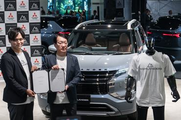 TOKYO, JAPAN - JULY 09:  Highlanders Inc. CEO Hiroya Masuoka (L) and Mitsubishi Motors Corp. Chairman and CEO Takao Kato (R) hold a signed Memorandum of Understanding (MOU) as they pose with a humanoid robot named N, manufactured by Highlanders, at its unveiling at the Mitsubishi Motors headquarters on July 09, 2026, in Tokyo, Japan. Mitsubishi Motors and Highlanders unveiled a prototype of a humanoid robot capable of transporting automobile parts and assembling engines on a production line. The robot is scheduled to enter mass production in Japan in 2027. (Photo by Tomohiro Ohsumi/Getty Images)