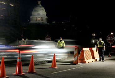 WASHINGTON - NOVEMBER 17:  U.S. Capitol Police officers check vehicles before they drive past the U.S. Capitol November 17, 2004 in Washington, DC. The security checkpoints have recently returned to locations around the Capitol.