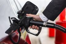 elegant man refuel at the gas station