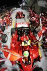 SINGAPORE - SEPTEMBER 28: Felipe Massa of Brazil and Ferrari drives off with his refuelling hose still attached while Kimi Raikkonen of Finland and Ferrari waits behind to come in for his pitstop during the Singapore Formula One Grand Prix at the Marina Bay Street Circuit on September 28, 2008 in Singapore. The event is the first Formula One race to be held at night. (Photo by Mark Thompson/Getty Images)