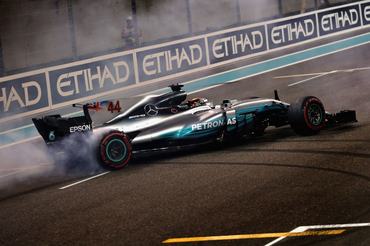 ABU DHABI, UNITED ARAB EMIRATES - NOVEMBER 26: Second place finisher Lewis Hamilton of Great Britain and Mercedes GP celebrates with donuts on track during the Abu Dhabi Formula One Grand Prix at Yas Marina Circuit on November 26, 2017 in Abu Dhabi, United Arab Emirates. (Photo by Mark Thompson/Getty Images)