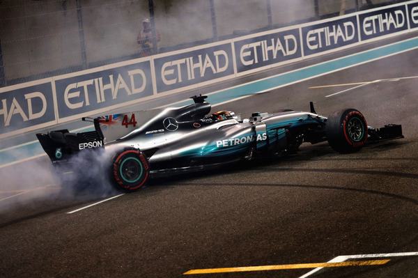 ABU DHABI, UNITED ARAB EMIRATES - NOVEMBER 26:  Second place finisher Lewis Hamilton of Great Britain and Mercedes GP celebrates with donuts on track during the Abu Dhabi Formula One Grand Prix at Yas Marina Circuit on November 26, 2017 in Abu Dhabi, United Arab Emirates.  (Photo by Mark Thompson/Getty Images)
