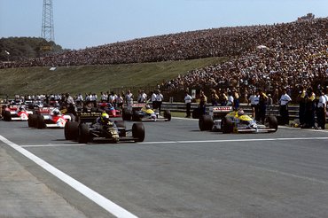 Ayrton Senna, Nelson Piquet, Lotus-Renault 98T, Williams-Honda FW11, Grand Prix of Hungary, Hungaroring, 10 August 1986. Ayrton Senna's Lotus-Renault on pole position, sharing the front row of the 1986 Hungarian Grand Prix with Nelson Piquet's Williams-Honda. (Photo by Paul-Henri Cahier/Getty Images)