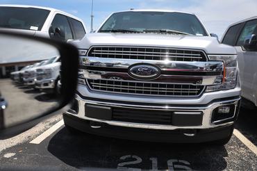 MIAMI, FL - MAY 10:  Ford F-150 pickup trucks are seen on a sales lot on May 10, 2018 in Miami, Florida. The company announced it is suspending production of its F-150 trucks after a fire at a supplier's facility caused it to run out of some parts needed in the production of the truck.  (Photo by Joe Raedle/Getty Images)