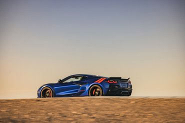 A rear 3/4 view of the 2027 Chevrolet Corvette Grand Sport in Admiral Blue Metallic.